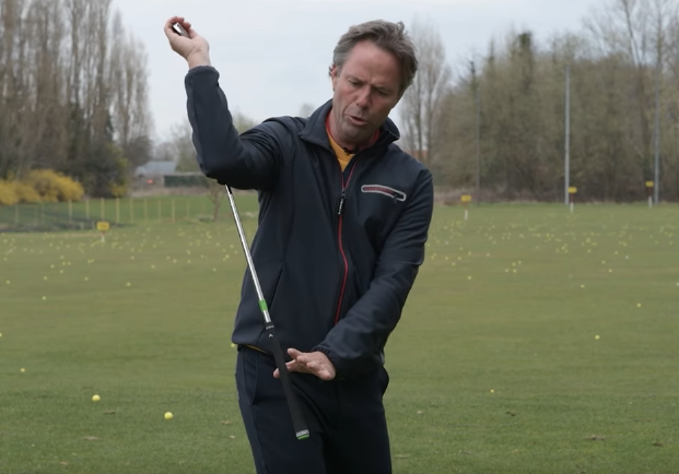 Drill to position the right elbow during the downswing